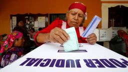 A woman casts a vote during the judicial and magistrate elections in San Bartolome Quialana in Mexico's Oaxaca state on Sunday.