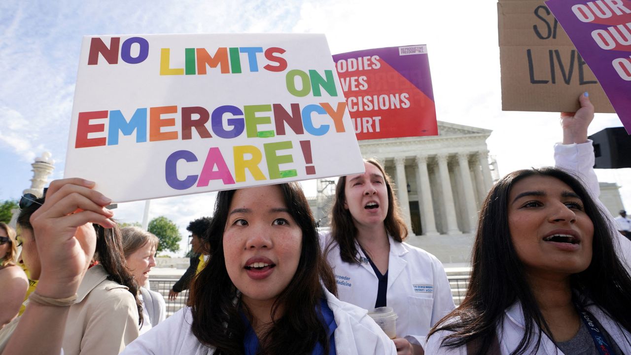 FILE PHOTO: Abortion rights supporters hold placards on the day the Supreme Court justices hear oral arguments over the legality of Idaho's Republican-backed, near-total abortion ban in medical-emergency situations, at the U.S. Supreme Court in Washington, U.S., April 24, 2024. REUTERS/Kevin Lamarque/File Photo