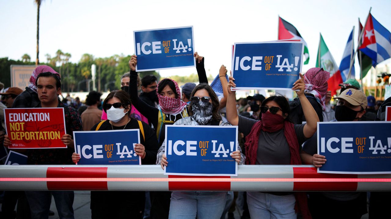 Protestors hold placards as they gather around the Los Angeles Federal Building following multiple detentions by Immigration and Customs Enforcement, in downtown Los Angeles, California, June 6, 2025.