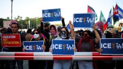 Protestors hold placards as they gather around the Los Angeles Federal Building following multiple detentions by Immigration and Customs Enforcement (ICE), in downtown Los Angeles, California, U.S., June 6, 2025. REUTERS/Daniel Cole