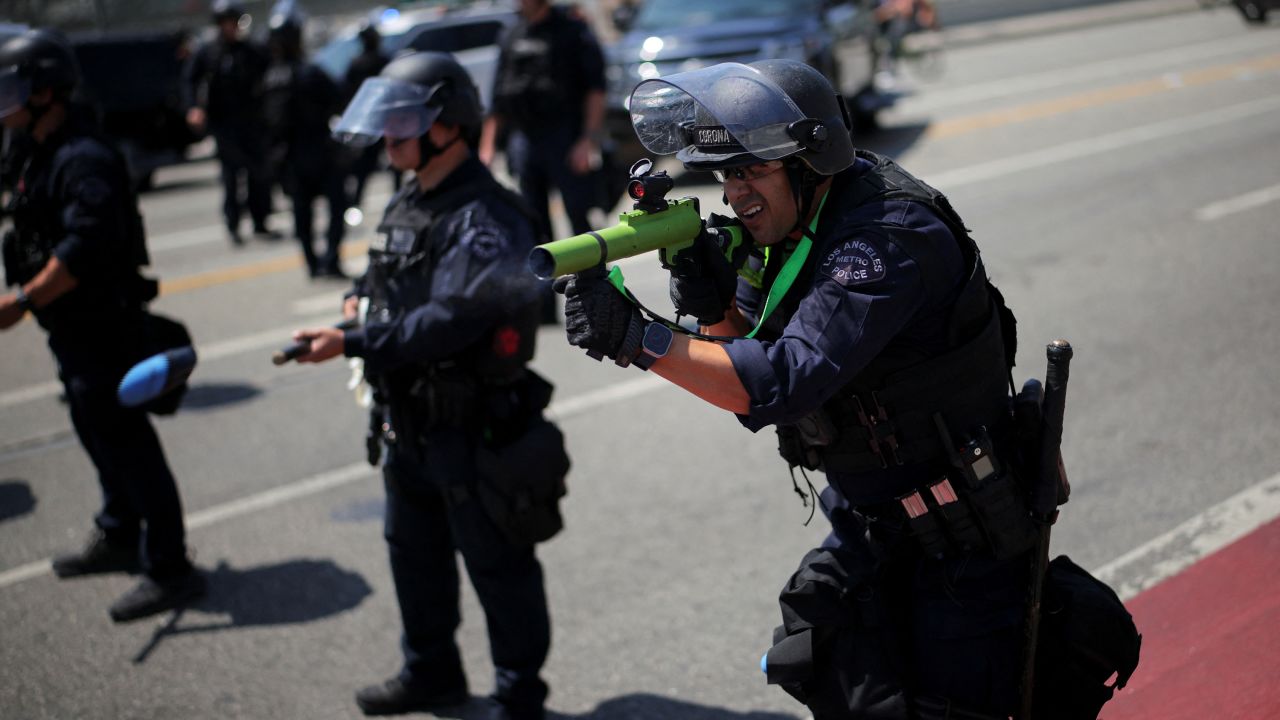 A member of the Los Angeles Metro Police fires a rubber bullet during a protest against federal immigration sweeps in downtown Los Angeles, California, U.S. June 8, 2025.