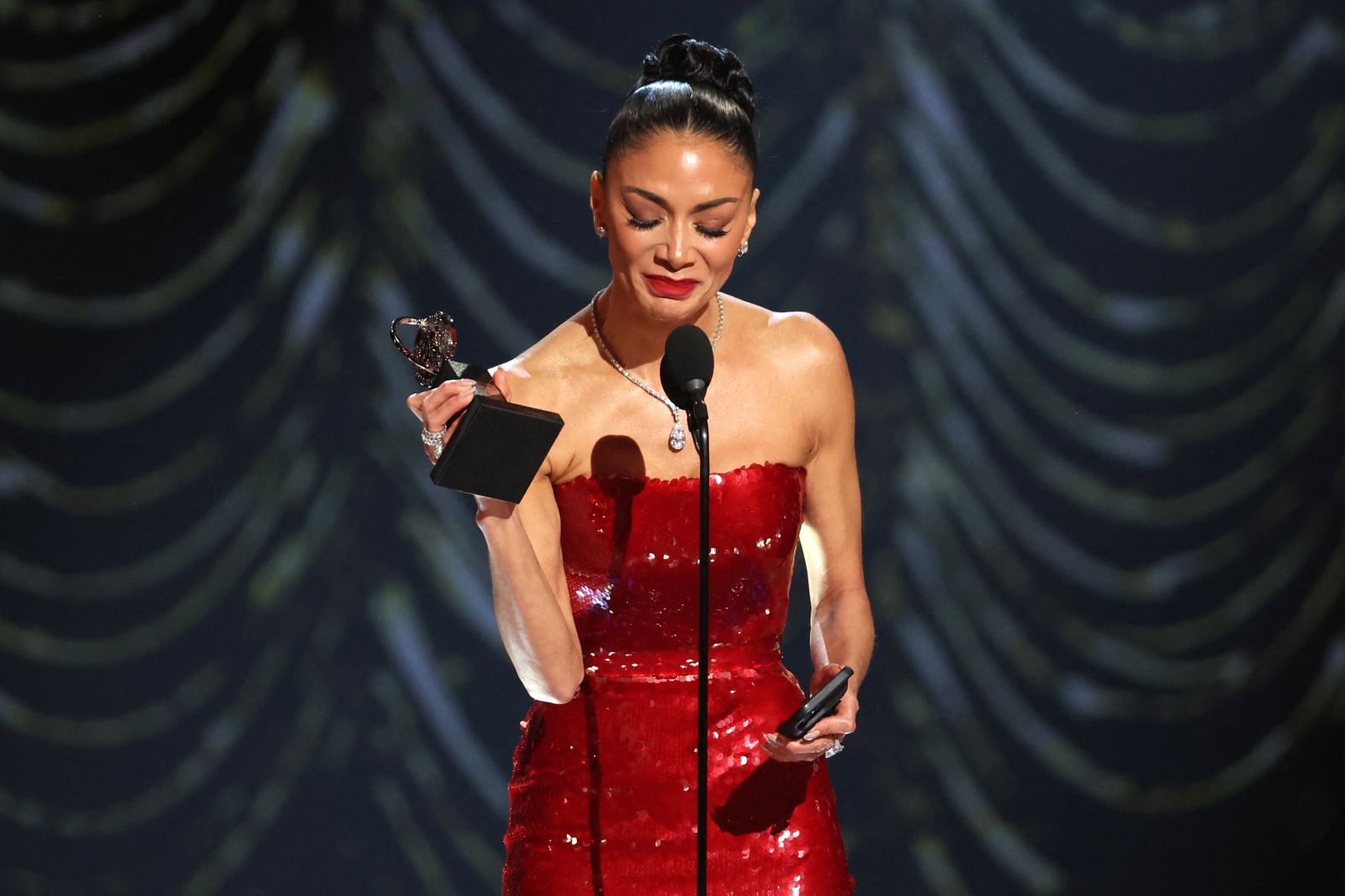 Nicole Scherzinger accepts the best performance by an actress in a leading role in a musical award for "Sunset Blvd."