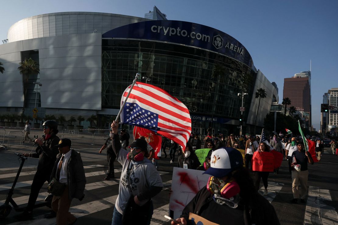 Demonstrators march near Crypto.com Arena in downtown Los Angeles on Tuesday, June 10, 2025.