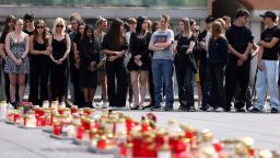 Mourners gather to observe a minute of silence for the victims of the school shooting in Graz, Austria, on Wednesday.