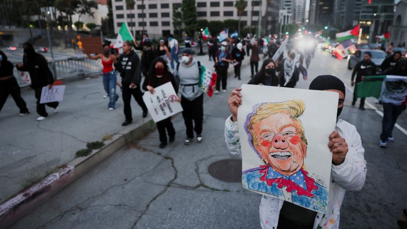 https://media.cnn.com/api/v1/images/stellar/prod/2025-06-12t033543z-993137052-rc2j0faxyskz-rtrmadp-3-usa-migration-protest-los-angeles.JPG?c=16x9&q=w_800,c_fill