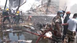 Emergency personnel work at the crash site of an Air India plane in Ahmedabad, India, June 12, 2025, in this still image taken from video. ANI/Reuters TV via REUTERS    THIS IMAGE HAS BEEN SUPPLIED BY A THIRD PARTY. INDIA OUT. NO COMMERCIAL OR EDITORIAL SALES IN INDIA. 