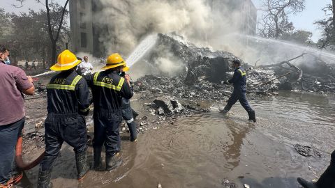 Rescue team members work as smoke rises at the site where an Air India plane crashed in Ahmedabad, India, June 12, 2025. REUTERS/Amit Dave     TPX IMAGES OF THE DAY     