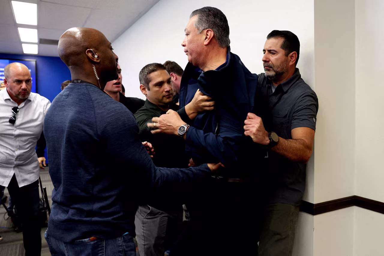 Sen. Alex Padilla is removed from a news conference in Los Angeles on Thursday.