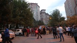 People gather in the street in the aftermath of Israeli strikes, in Tehran, Iran, June 13, 2025.