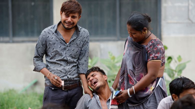 Kalpeshbhqi Patni, 28, mourns as he waits outside the postmortem room at a hospital, for his brother Akash Patni, 14, who died when an Air India Boeing 787-8 Dreamliner plane crashed during take-off from an airport, in Ahmedabad, India, June 13, 2025. REUTERS/Adnan Abidi