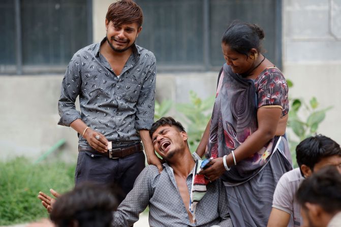 Kalpeshbhqi Patni cries out as he waits outside a hospital in Ahmedabad, India, on Friday, June 13. His brother Akash died in the plane that crashed there the previous day.