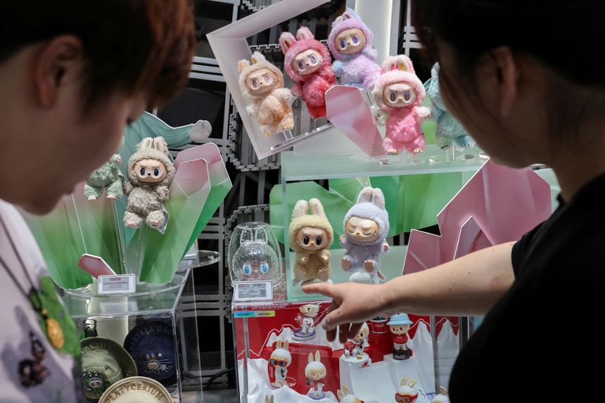 People look at Labubu dolls at the flagship store of Pop Mart in Shanghai, China June 13, 2025.