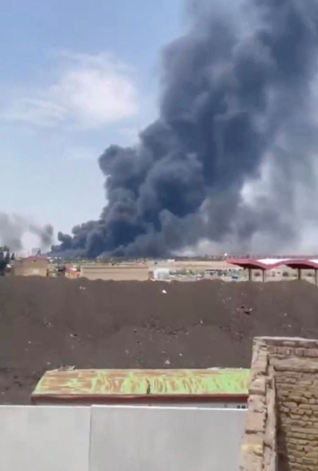 In this screengrab from social media, smoke is seen rising from Tabriz airport in Iran on June 13, 2025, following Israeli strikes.