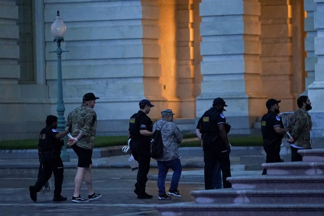 Protesters are detained after breaking through barrier fencing on Capitol Hill in Washington, DC, on June 13, 2025.