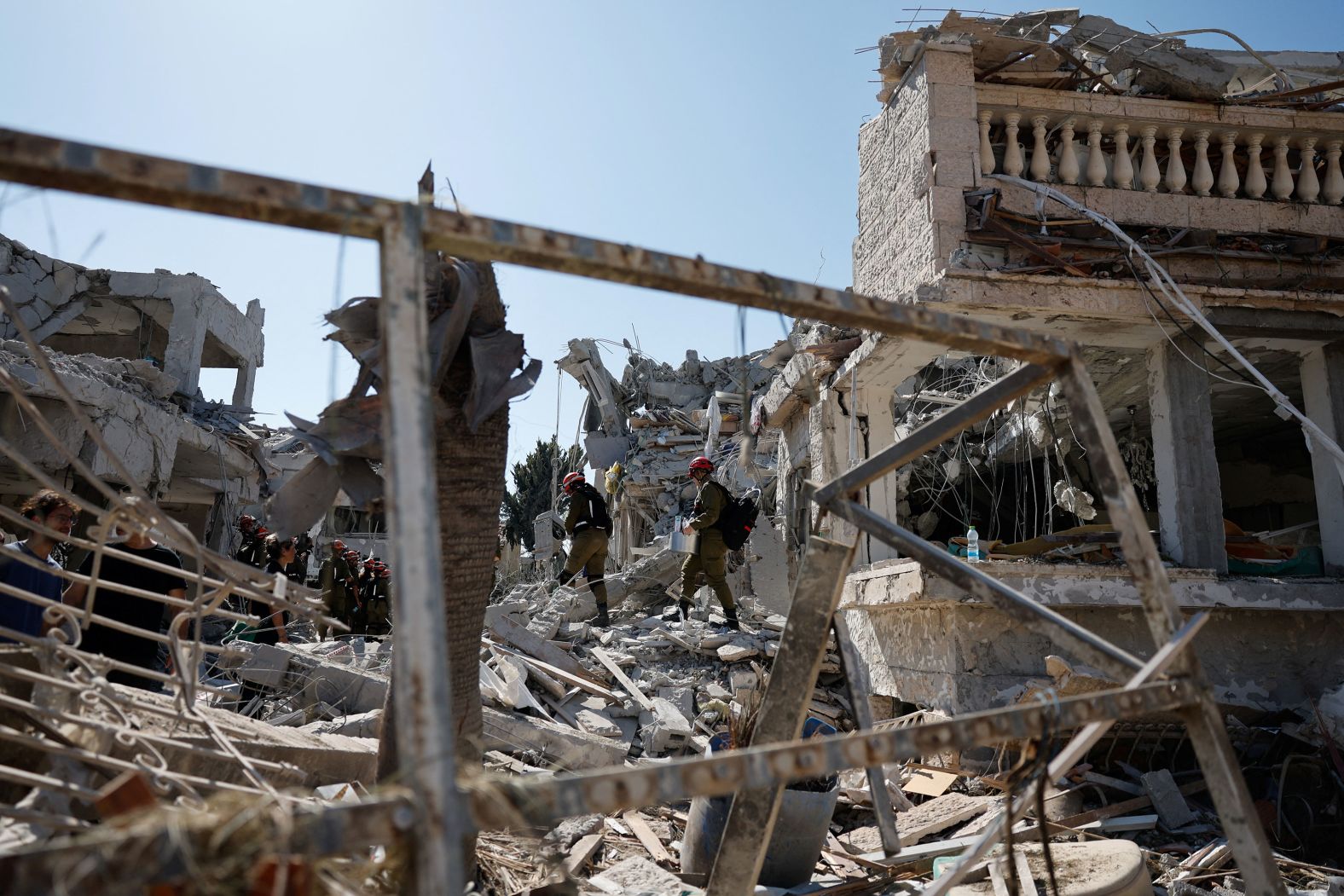 Rescue personnel work at an impact site after a missile attack from Iran in Rishon Lezion, Israel, on Saturday.