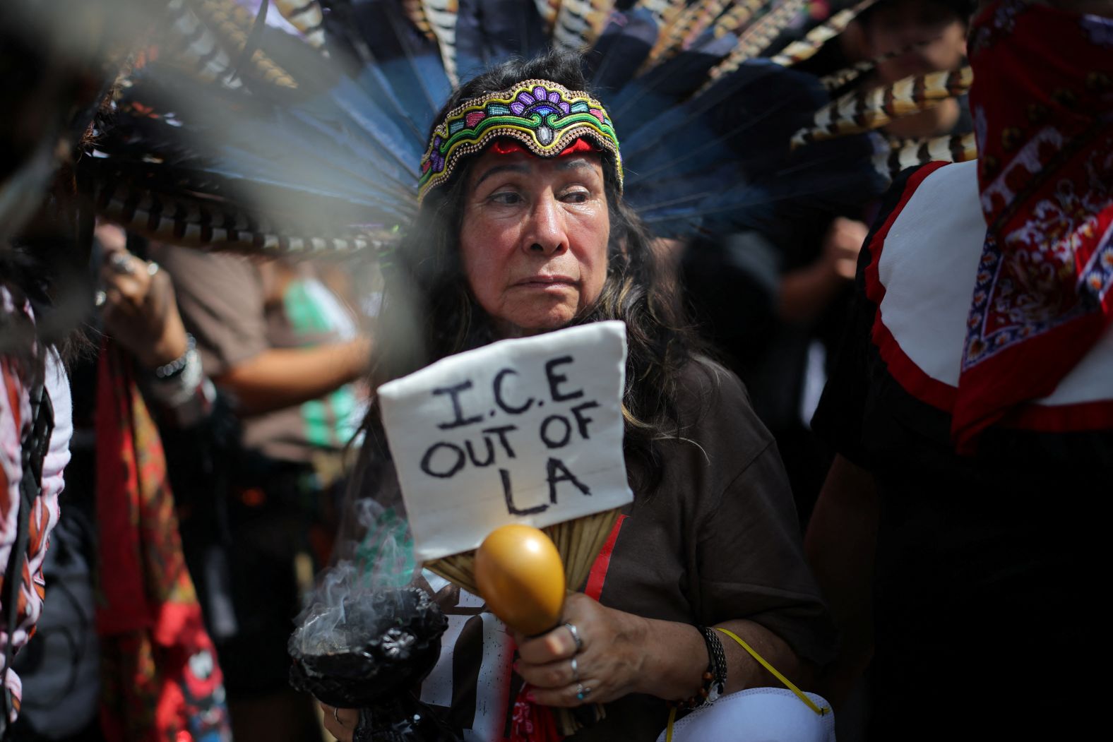A demostrator wearing indigenous attire takes part in the "No Kings" protest in Los Angeles.