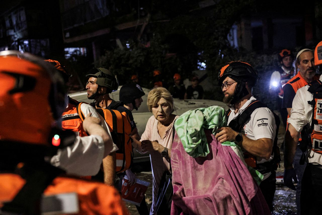 Rescue and security guards help the woman injured by Yam Yam bat.