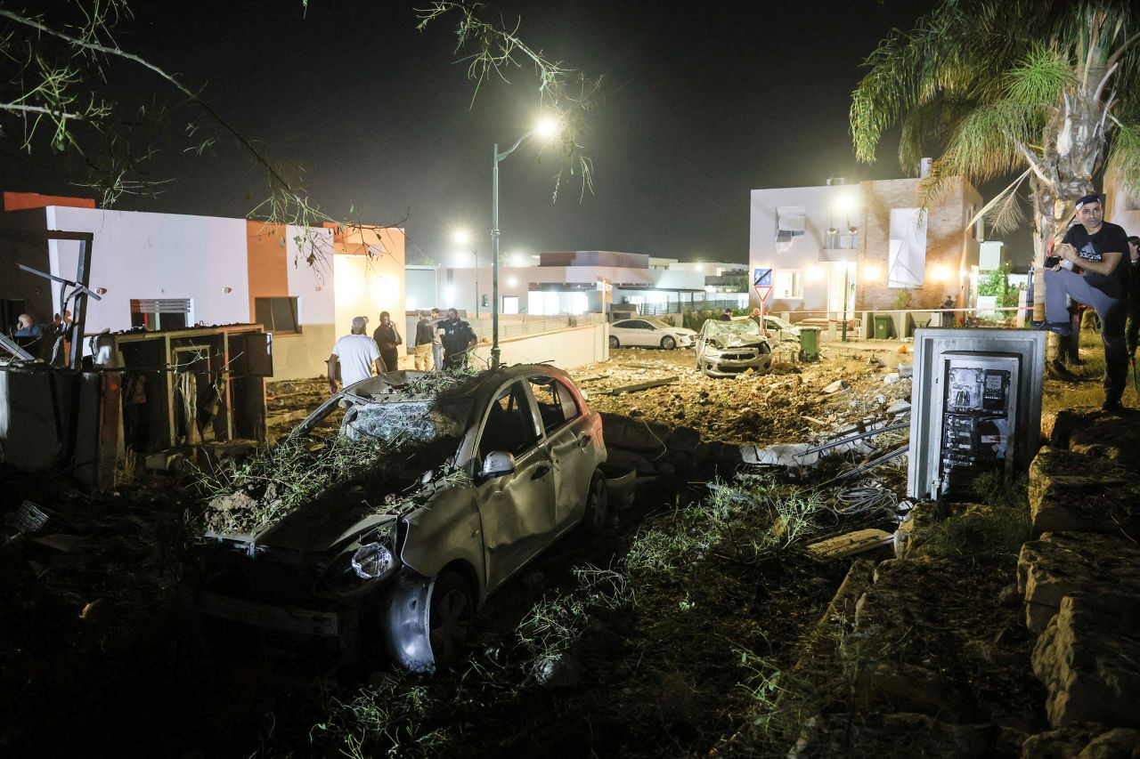 Security and rescue personnel work at an impact site following missile attack from Iran in Zavdiel, Israel, on Sunday.
