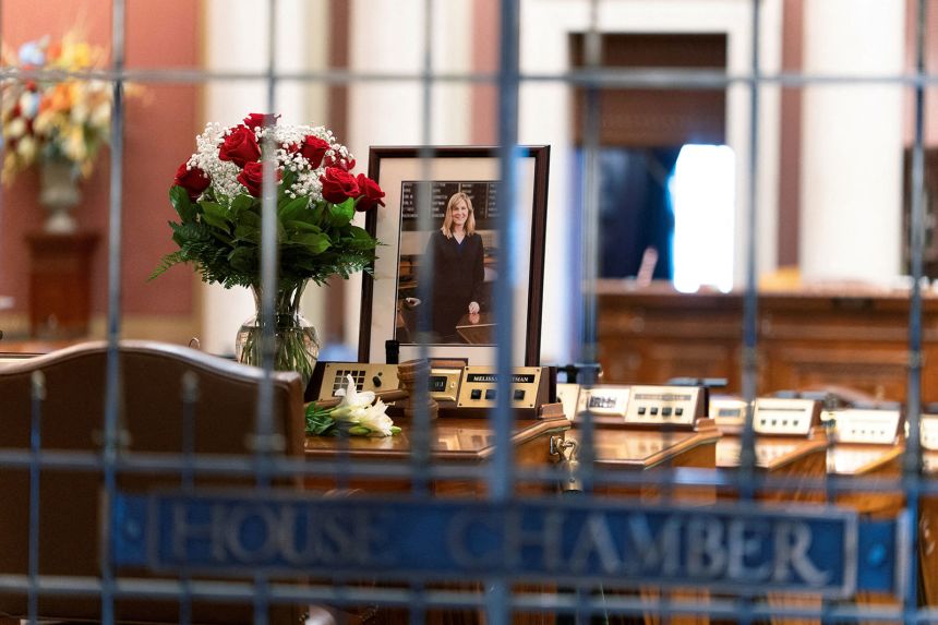 Flowers and a portrait of slain Democratic state lawmaker Melissa Hortman lie on Hortman's desk in the Minnesota House Chambers on June 16.