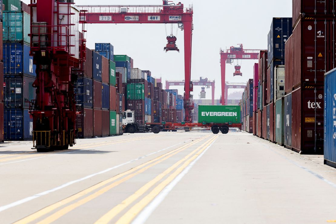 Gantry cranes stand near shipping containers at Yangshan Port outside of Shanghai, China, on June 17.