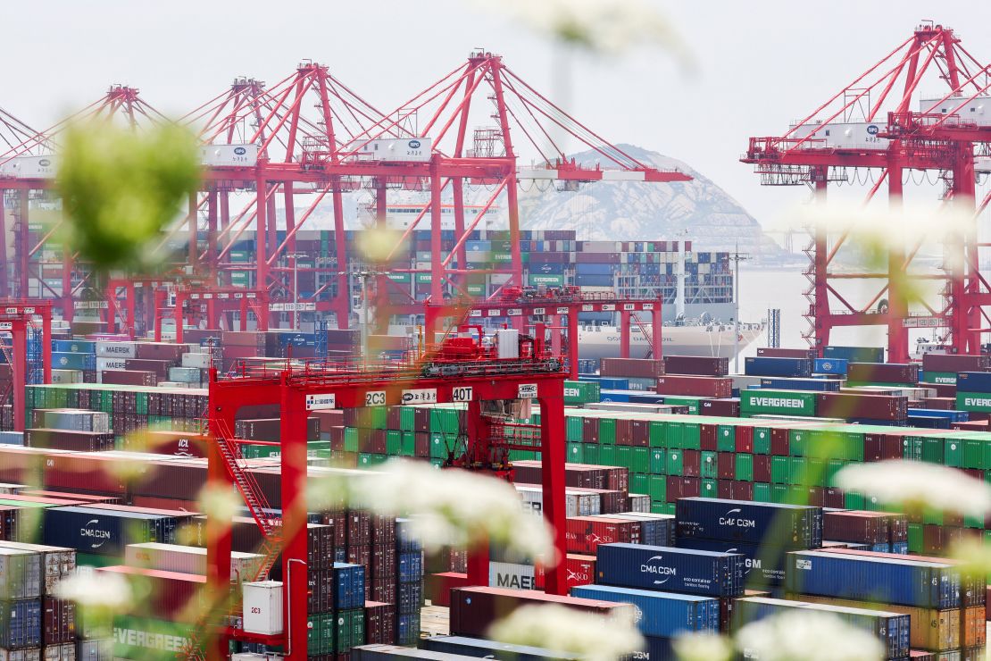 Gantry cranes stand near shipping containers at Yangshan Port outside of Shanghai, China, June 17, 2025.