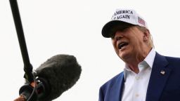 President Donald Trump speaks to members of the media during the installation of a new flagpole on the South Lawn at the White House.