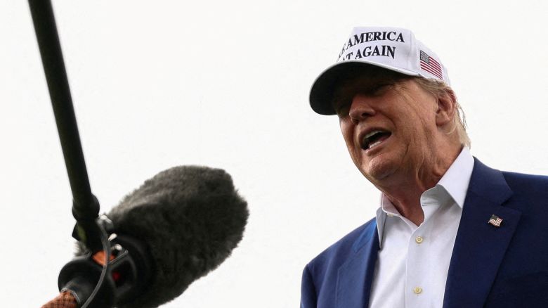 President Donald Trump speaks to members of the media during the installation of a new flagpole on the South Lawn at the White House.