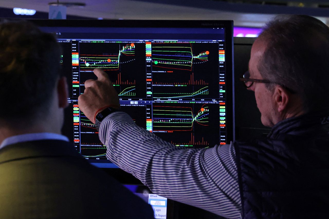 Traders work on the floor at the New York Stock Exchange today.