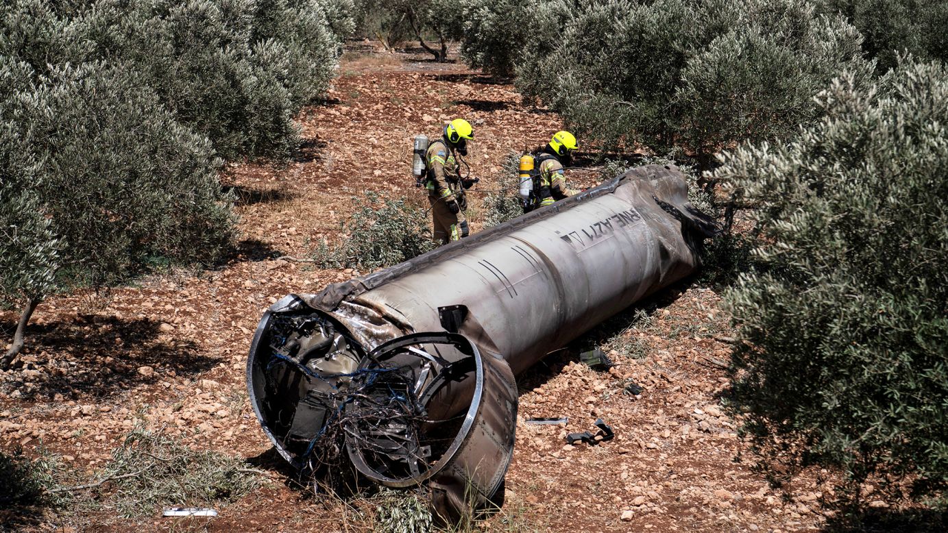 Members of the Israeli special forces check the apparent remains of a ballistic missile lying on the ground before being evacuated from the location where they were found, following missile attacks by Iran on Israel in June.