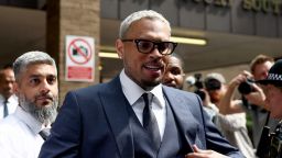 U.S. singer Chris Brown, who has been charged with inflicting grievous bodily harm in what prosecutors said was an "unprovoked attack" on a music producer at the Tape nightclub in central London in 2023, walks outside Southwark Crown Court in London, Britain, June 20, 2025. REUTERS/Isabel Infantes