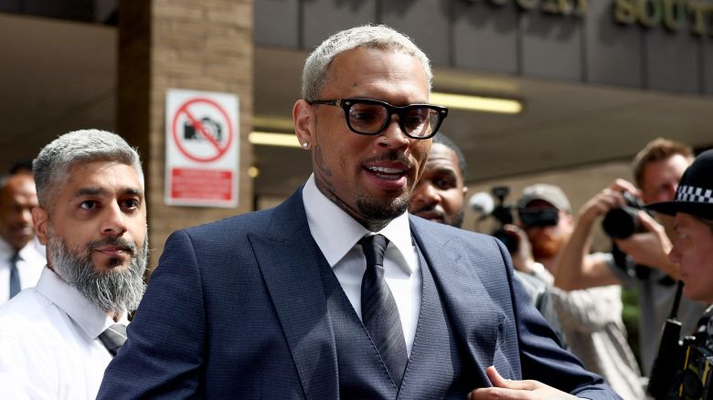 U.S. singer Chris Brown, who has been charged with inflicting grievous bodily harm in what prosecutors said was an "unprovoked attack" on a music producer at the Tape nightclub in central London in 2023, walks outside Southwark Crown Court in London, Britain, June 20, 2025. REUTERS/Isabel Infantes