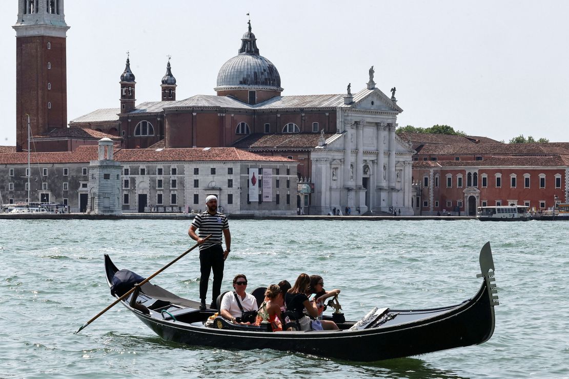 A gondolier rows in front of San Giorgio Maggiore island on Sunday ahead of the Bezos-Sanchez wedding.
