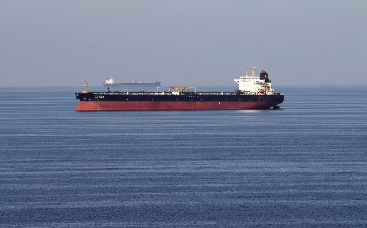 Oil tankers pass through the Strait of Hormuz.
