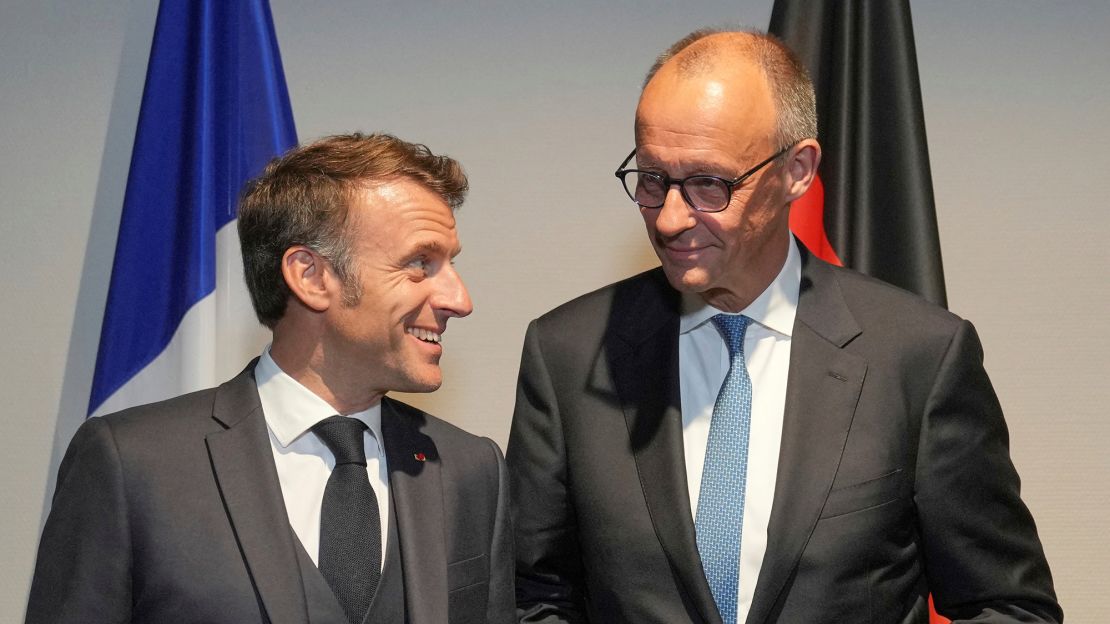 French President Emmanuel Macron speaks with Germany's Chancellor Friedrich Merz before a meeting on the sidelines of the NATO summit in The Hague, Netherlands, on June 24, 2025.