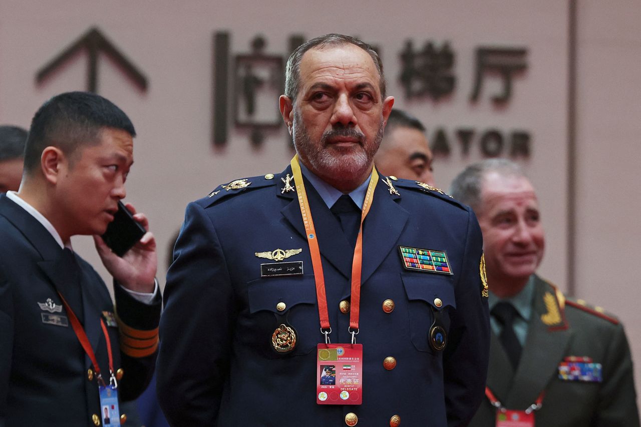 Iranian Defense Minister Aziz Nasirzadeh waits for a group photo session before the Shanghai Cooperation Organization Defense Ministers' Meeting in Qingdao, Shandong province, China, on Thursday.