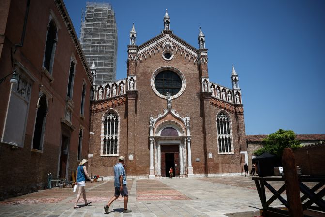 People walk past the Madonna dell’Orto church in Venice ahead of the wedding festivities on Thursday.