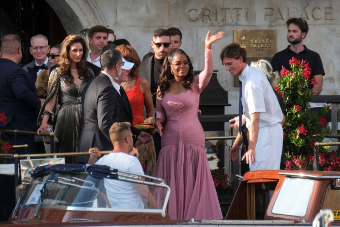 Oprah Winfrey leaves the Gritti Palace hotel as she travels to San Giorgio Maggiore for the wedding on Friday.
