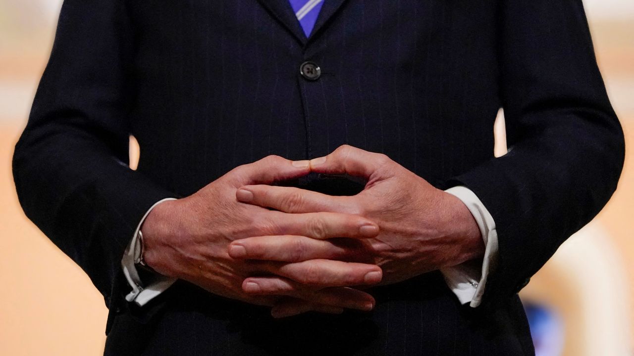 Treasury Secretary Scott Bessent intertwines hands while speaking to reporters at the US Capitol in Washington, DC, on June 27.