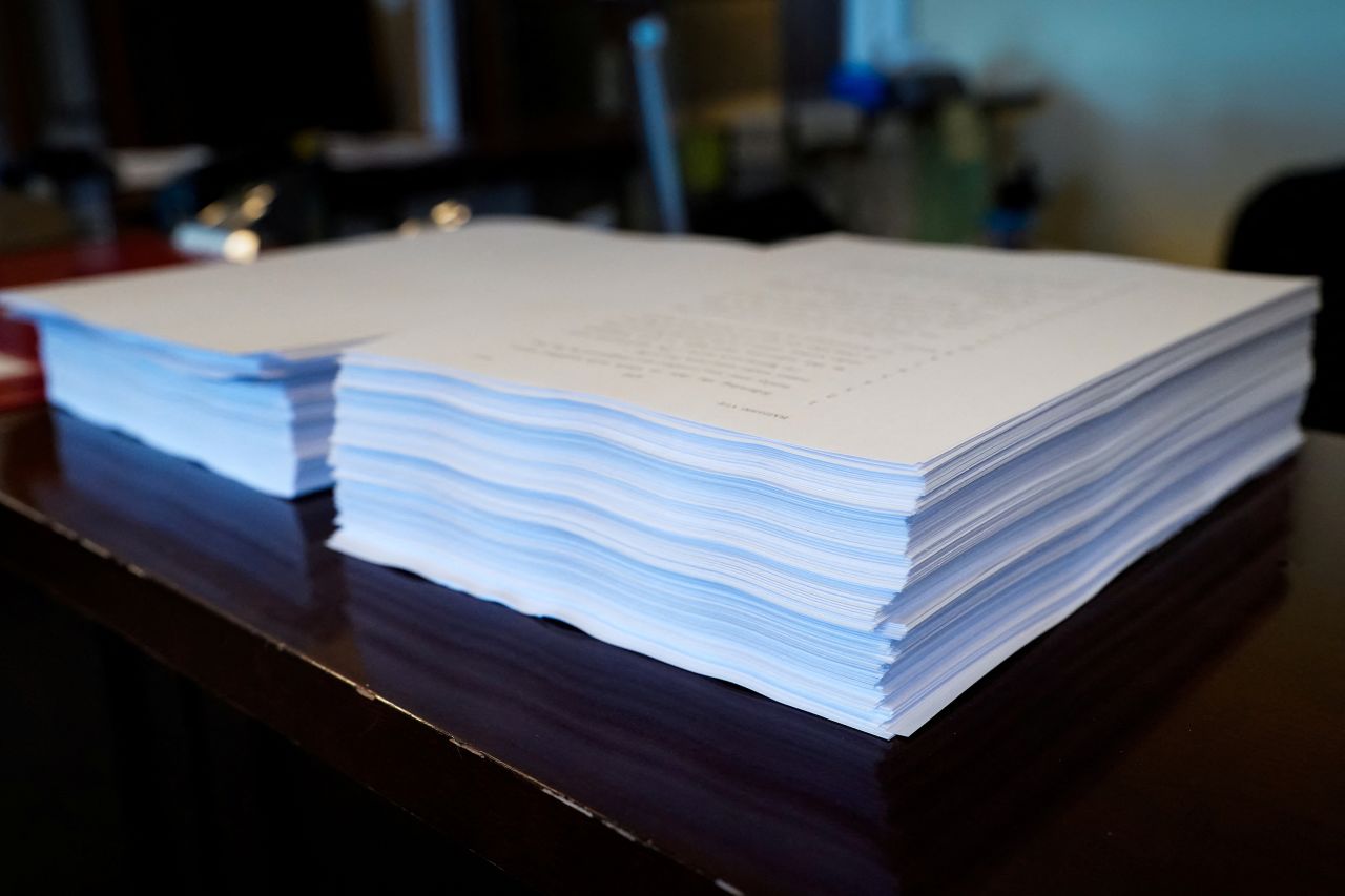 A copy of President Donald Trump’s spending and tax bill is seen on a desk as clerks continue reading the bill aloud in in Washington, DC on Sunday.
