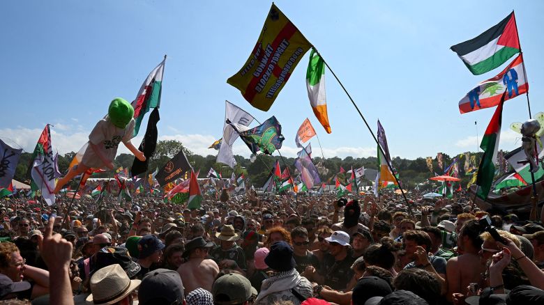 Revellers gather as Kneecap performs at Glastonbury Festival at Worthy Farm in Pilton, Somerset, Britain, June 28, 2025.