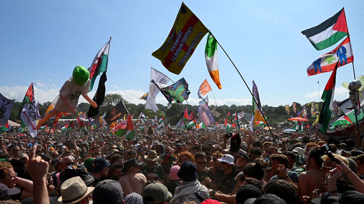 Revellers gather as Kneecap performs at Glastonbury Festival at Worthy Farm in Pilton, Somerset, Britain, June 28, 2025.