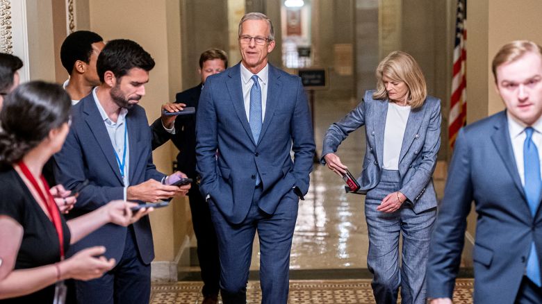 U.S. Senate Majority Leader John Thune (R-SD) and U.S. Sen. Lisa Murkowski (R-AK) walk to the Senate floor as Republican lawmakers struggle to pass U.S. President Donald Trump's sweeping spending and tax bill, on Capitol Hill in Washington, D.C., U.S., July 1, 2025. REUTERS/Nathan Howard
