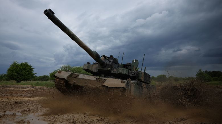 Polish soldiers ride the South Korean-made K2 Black Panther tank during a practice in Braniewo, Poland, on June 24, 2025.