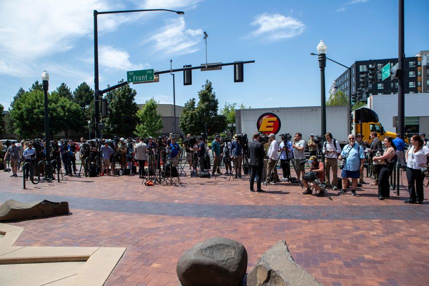 Members of the media gather outside the Ada County Courthouse in Boise Wednesday.