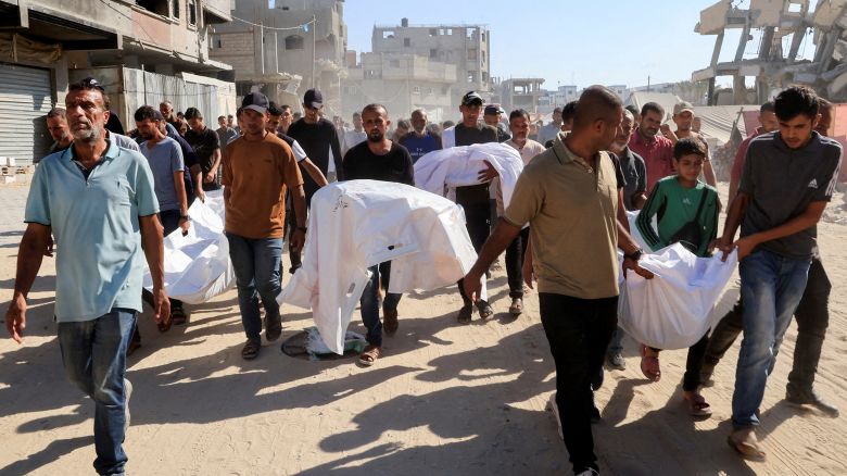 Mourners carry the bodies of Palestinians who were killed in an overnight Israeli strike, according to Gaza's health ministry, in Khan Younis on Thursday.
