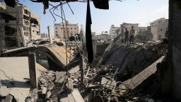 Palestinians inspect the site of an Israeli strike that damaged and destroyed residential buildings, at Shati refugee camp, in Gaza City, July 4, 2025.