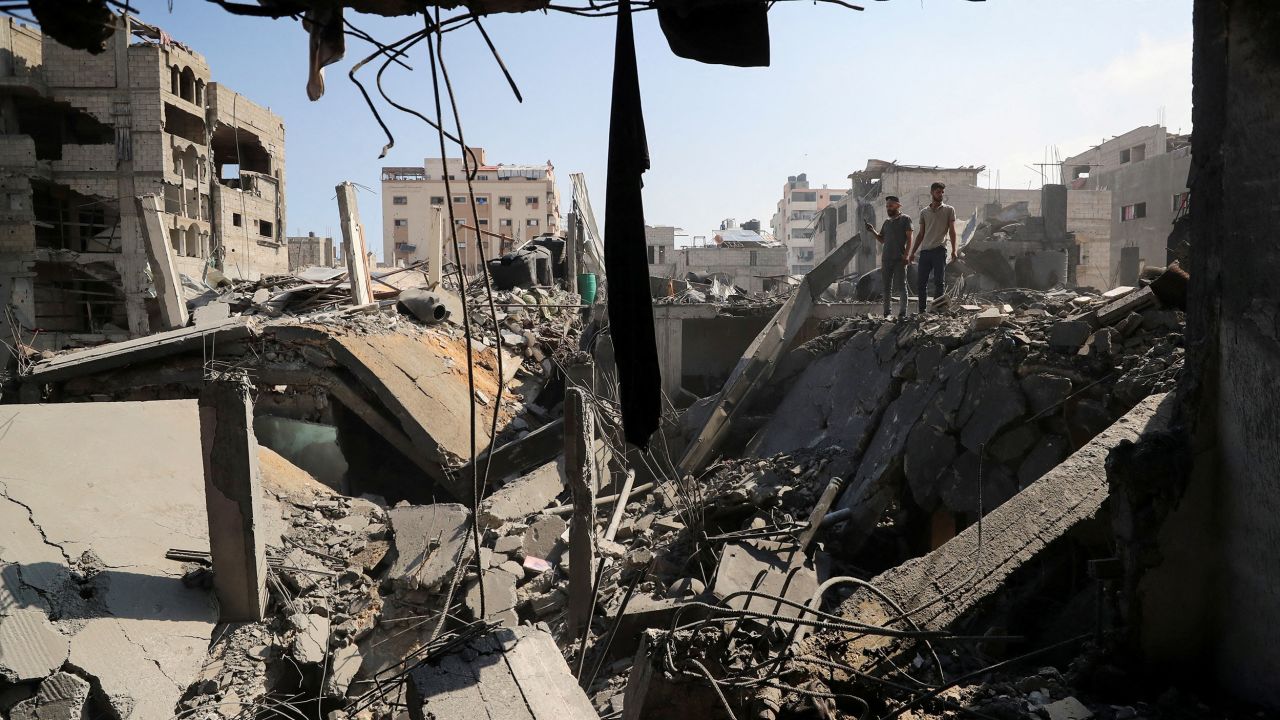 Palestinians inspect the site of an Israeli strike that damaged and destroyed residential buildings, at Shati refugee camp, in Gaza City, July 4, 2025.