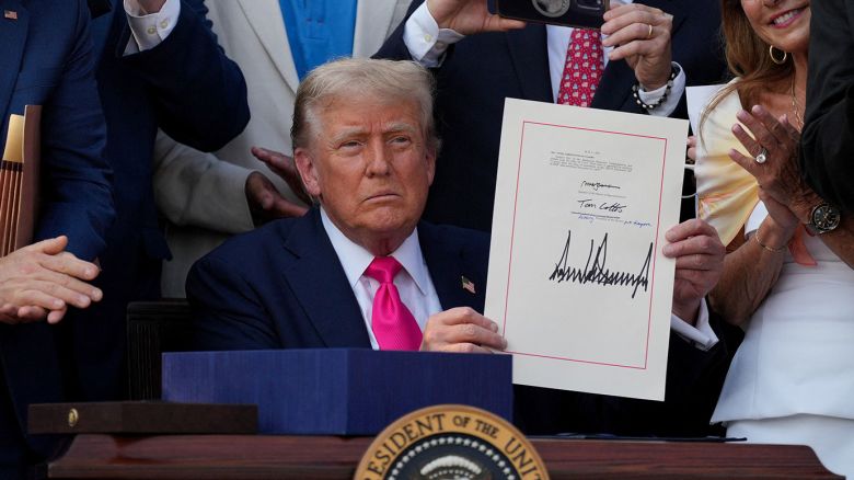 U.S. President Donald Trump presents a sweeping spending and tax legislation, known as the "One Big Beautiful Bill Act," after he signed it, at the White House in Washington, D.C., U.S., July 4, 2025. REUTERS/Leah Millis