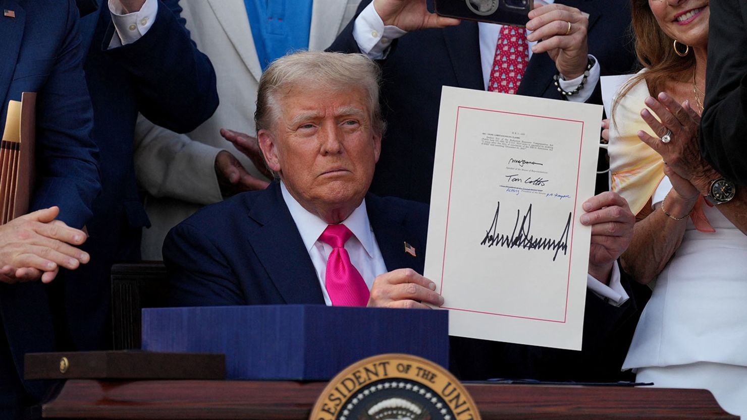 President Donald Trump presents a sweeping spending and tax legislation, known as the "One Big Beautiful Bill Act," after he signed it, at the White House in Washington, DC, on July 4, 2025.