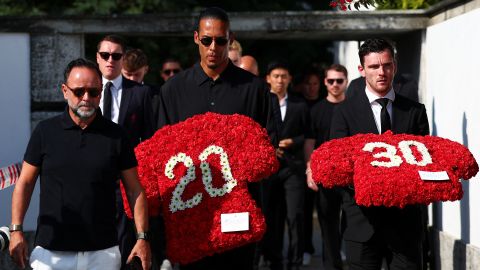 Liverpool's captain Virgil van Dijk and left back Andy Robertson arrive at the funeral ceremony of their former teammate Diogo Jota and his brother André Silva.